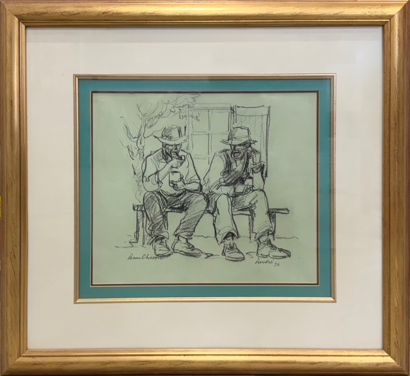 2 men sitting by André de Beer