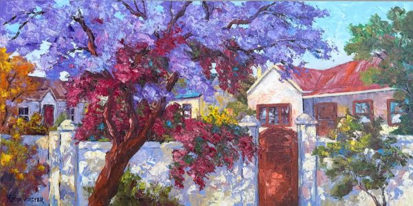 Jacaranda house wall with wooden gate