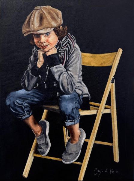 Boy sitting on chair